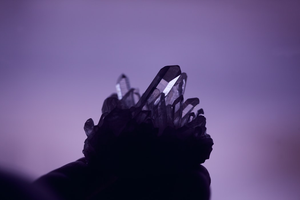 crystal against a purple background